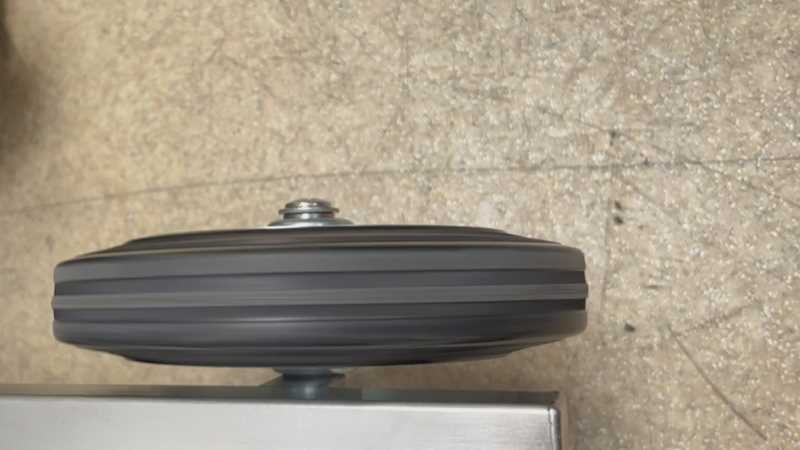 Conductive rubber castor wheel and support during a rotation check