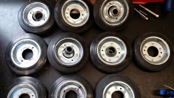 Separated metal hubs, axles, and rims from rubber wheel assemblies